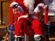 Nella foto Babbo Natale in visita all'associazione abBRAcciAMO di Bra