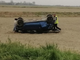 Auto capottata nei campi